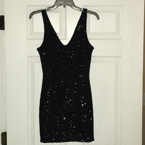 bebe Dresses & Skirts - Black sequin BEBE black mini dress.